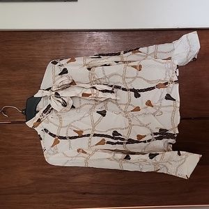 Multi brown blouse. Has ties to make bow attached to high collared blouse